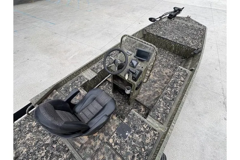 Slide: The Image of 2013 Gator Trax 17X54 boat with camo design, steering console, and seating. - 8