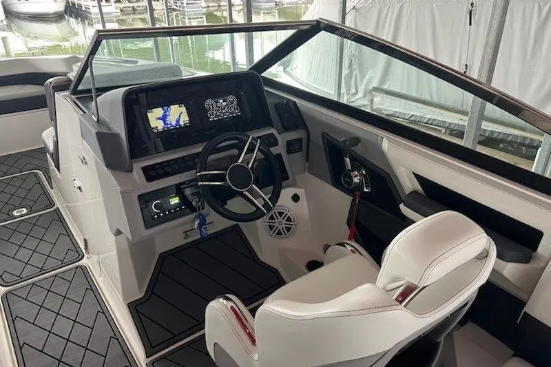 Slide: The Image of 2021 Cobalt R8 boat cockpit with modern steering, navigation screens, and white seating. - 17