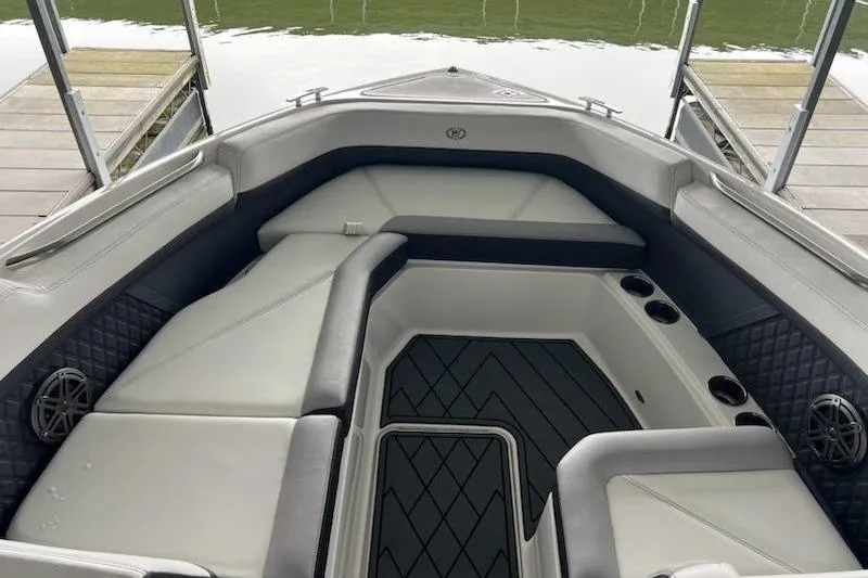 Slide: The Image of 2021 Cobalt R8 boat interior with cushioned seating and cup holders. - 8