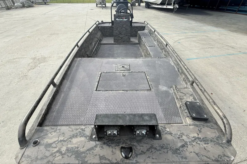Slide: The Image of 2018 Gator Tail 1860cc Extreme boat with camo design on concrete surface. - 9