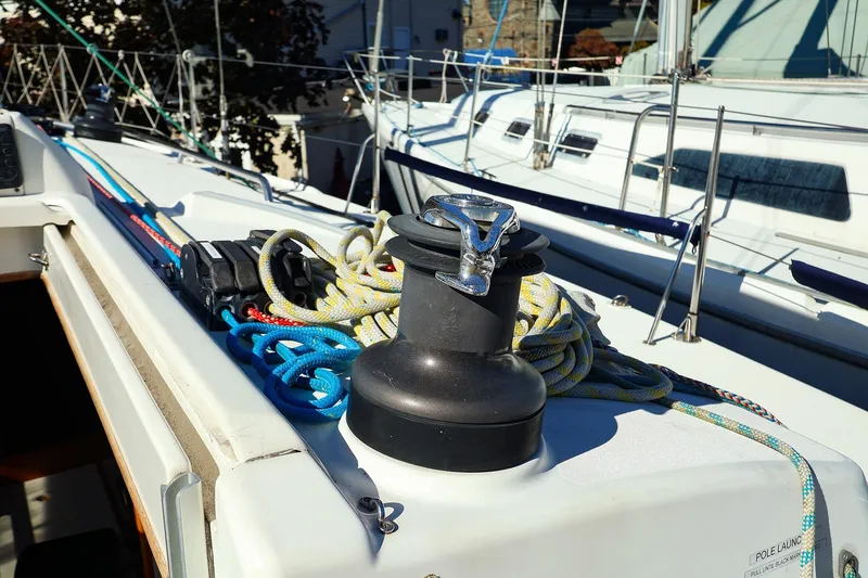 Slide: The Image of 2005 J Boats J/133 sailboat deck with winch and colorful ropes. - 12
