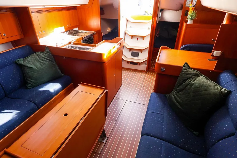 Slide: The Image of Interior of 2005 J Boats J/133 yacht with cozy seating and wooden finishes. - 17