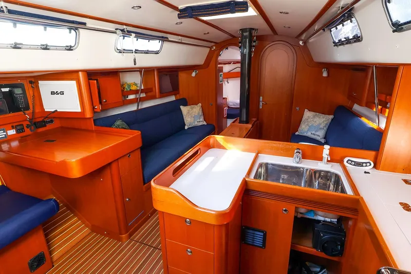 Slide: The Image of Interior of 2005 J Boats J/133 sailboat with wood finish and modern amenities. - 18