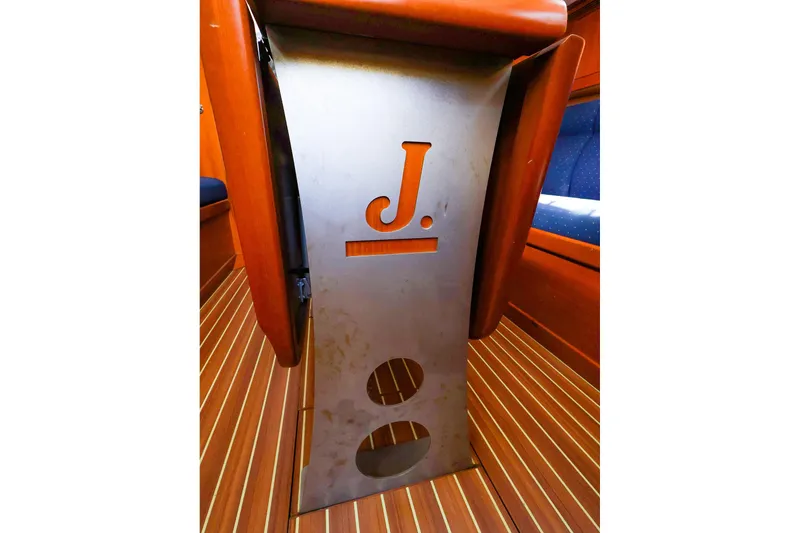 Slide: The Image of Interior view of 2005 J Boats J/133 with wooden flooring and metal detailing. - 31