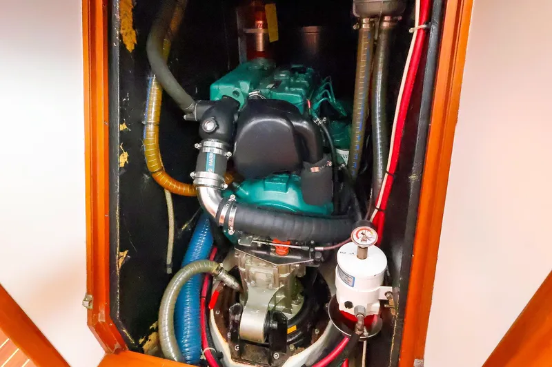 Slide: The Image of Engine compartment of a 2005 J Boats J/133 sailboat, showcasing detailed mechanical components. - 36