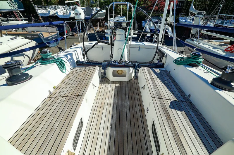 Slide: The Image of 2005 J Boats J/133 sailboat cockpit with wooden deck and steering wheel. - 7