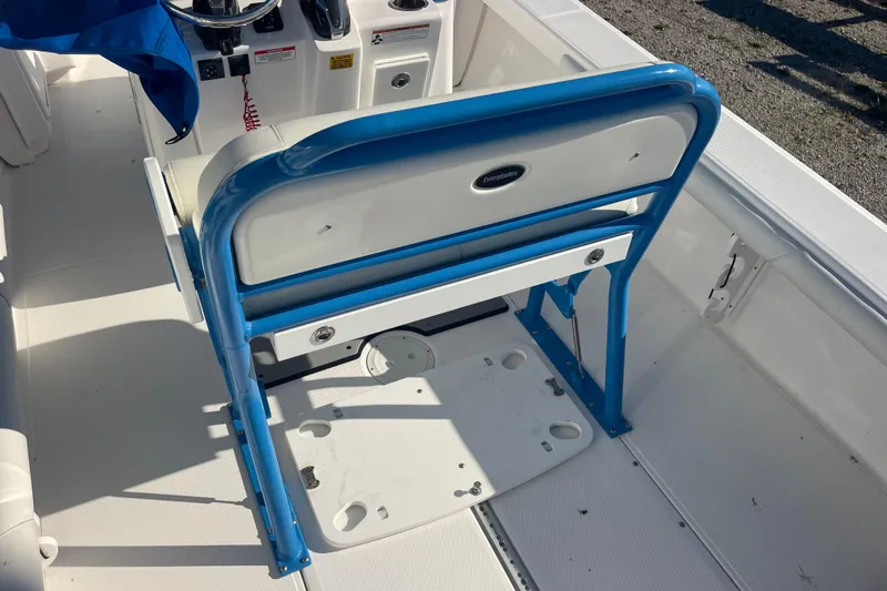 Slide: The Image of 2021 Everglades 243 Center Console boat interior with blue and white seating. - 13