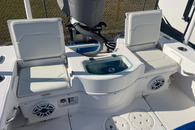 Slide: The Image of 2021 Everglades 243 Center Console boat interior with seating and livewell. - 14
