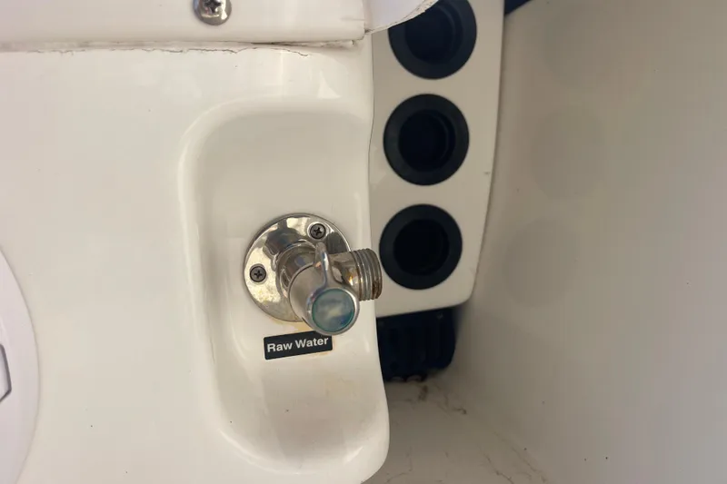 Slide: The Image of 2021 Everglades 243 Center Console raw water outlet detail. - 16