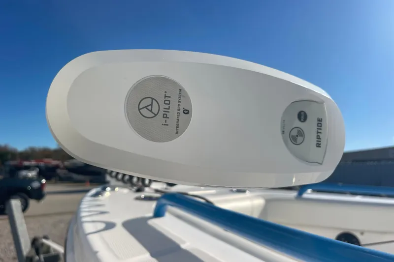 Slide: The Image of 2021 Everglades 243 Center Console with i-Pilot GPS system under clear blue sky. - 30