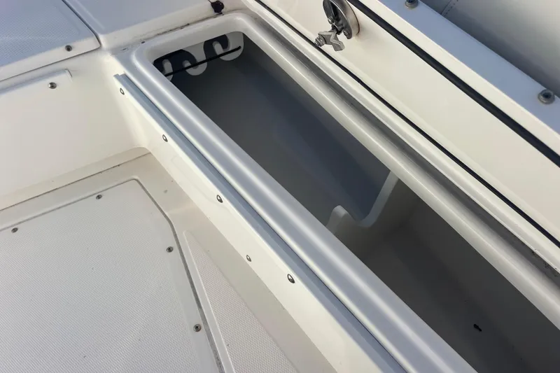 Slide: The Image of Storage compartment on a 2021 Everglades 243 Center Console boat. - 38