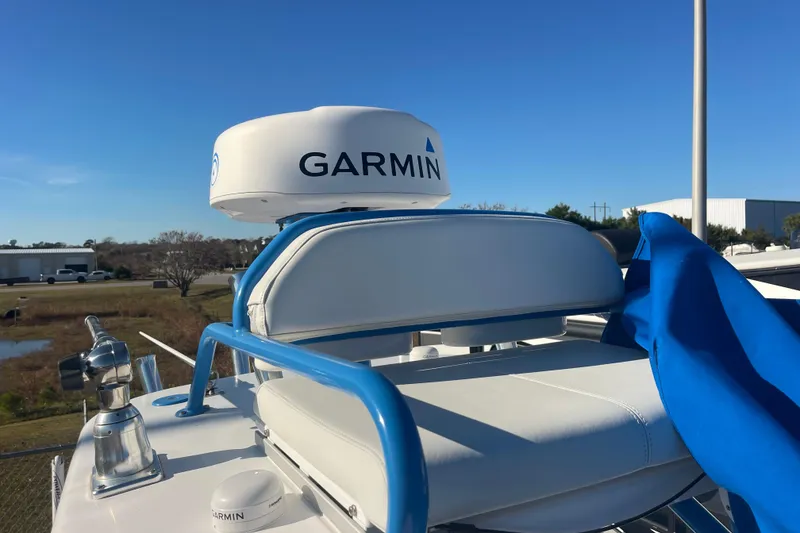 Slide: The Image of 2021 Everglades 243 Center Console with Garmin radar, blue sky background. - 46