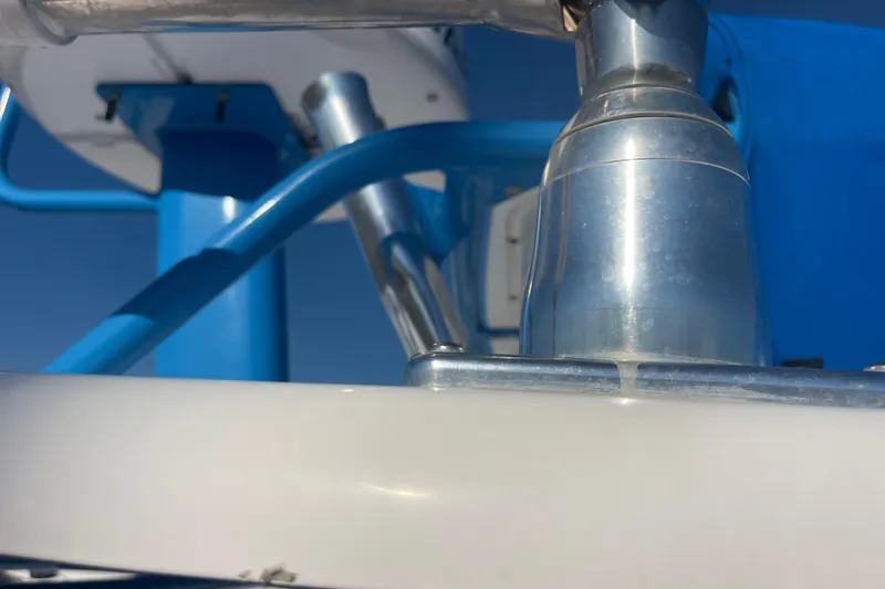 Slide: The Image of Close-up of 2021 Everglades 243 Center Console boat's metal and blue structural components. - 49