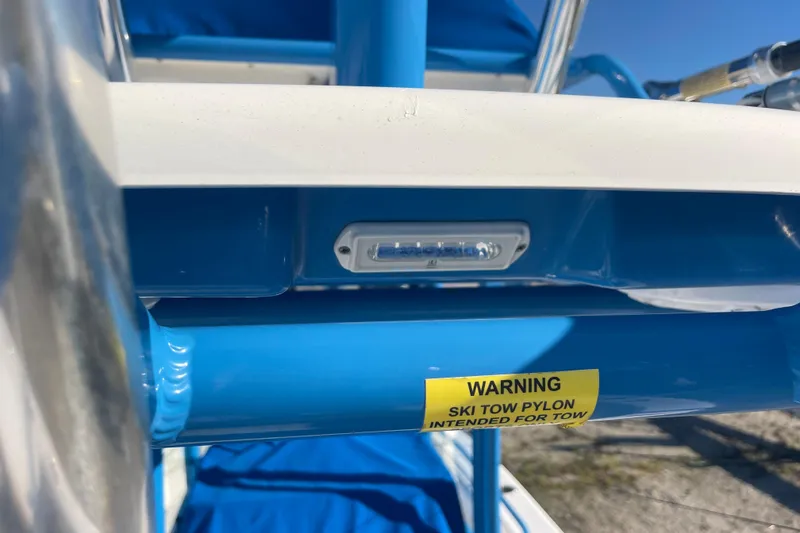 Slide: The Image of Close-up of 2021 Everglades 243 Center Console boat's ski tow pylon warning label. - 52