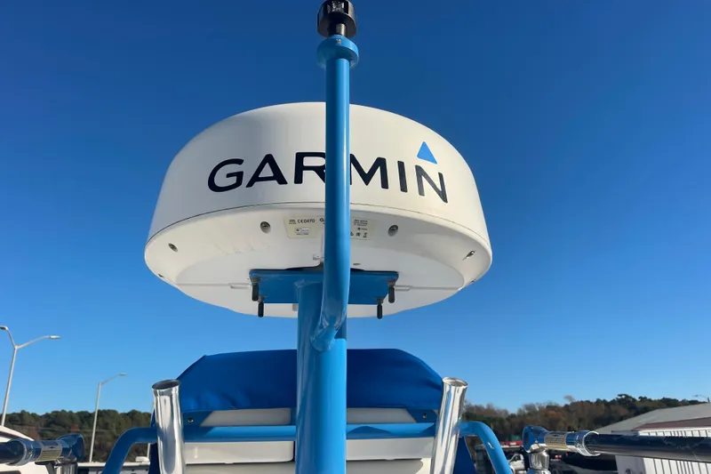 Slide: The Image of Garmin radar on 2021 Everglades 243 Center Console boat under clear blue sky. - 53