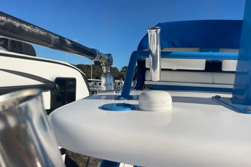 Slide: The Image of 2021 Everglades 243 Center Console boat detail with blue accents and stainless steel fittings. - 54