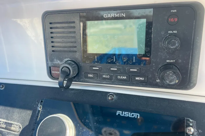 Slide: The Image of Garmin marine radio on 2021 Everglades 243 Center Console boat dashboard. - 9