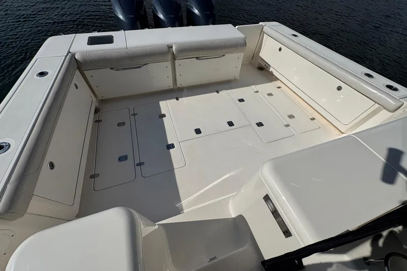 Slide: The Image of Spacious deck of 2011 Pursuit OS 375 Offshore boat with seating and storage. - 10