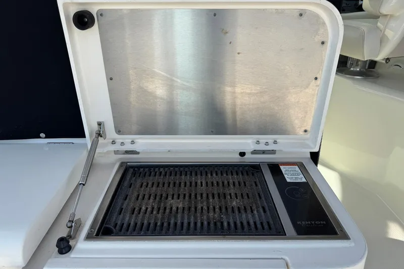 Slide: The Image of Outdoor grill on 2011 Pursuit OS 375 Offshore boat, featuring Kenyon electric cooktop. - 18