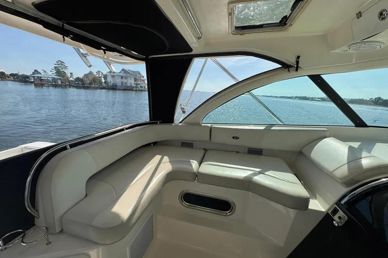 Slide: The Image of Interior view of 2011 Pursuit OS 375 Offshore boat with waterfront scenery. - 22