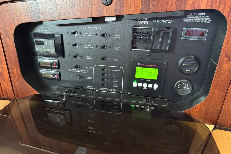 Slide: The Image of Electrical control panel of a 2011 Pursuit OS 375 Offshore boat. - 33