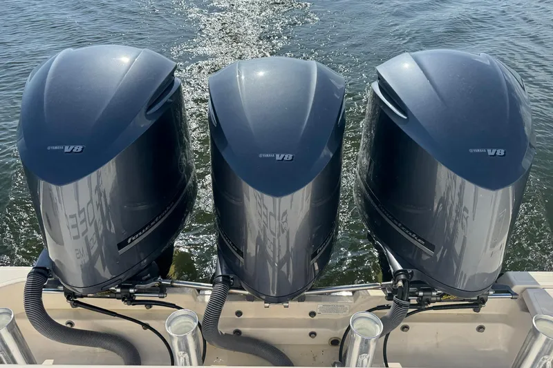 Slide: The Image of Triple Yamaha V8 engines on a 2011 Pursuit OS 375 Offshore boat. - 8