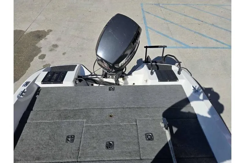 Slide: The Image of 1997 Javelin 389 FS boat with outboard motor and carpeted deck. - 14