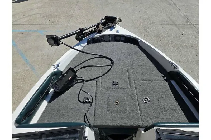 Slide: The Image of 1997 Javelin 389 FS boat deck with trolling motor and carpeted surface. - 9