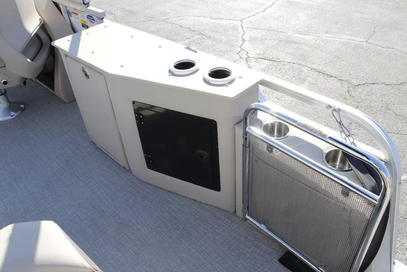 Slide: The Image of 2026 Avalon LSZ Cruise Rear Bench boat interior with cup holders and storage. - 11