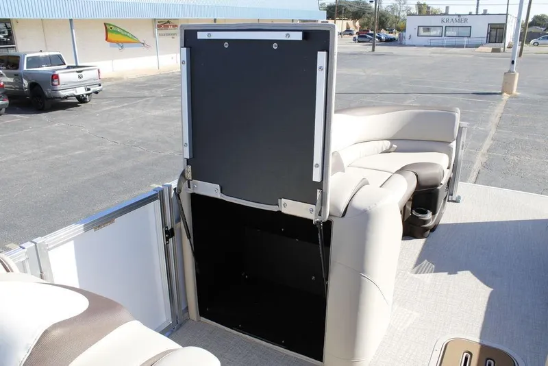 Slide: The Image of 2026 Avalon LSZ Cruise Rear Bench boat interior with seating and storage compartment. - 19