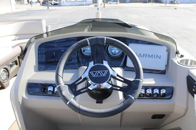 Slide: The Image of Steering console of 2026 Avalon LSZ Cruise Rear Bench boat with Garmin navigation system. - 24