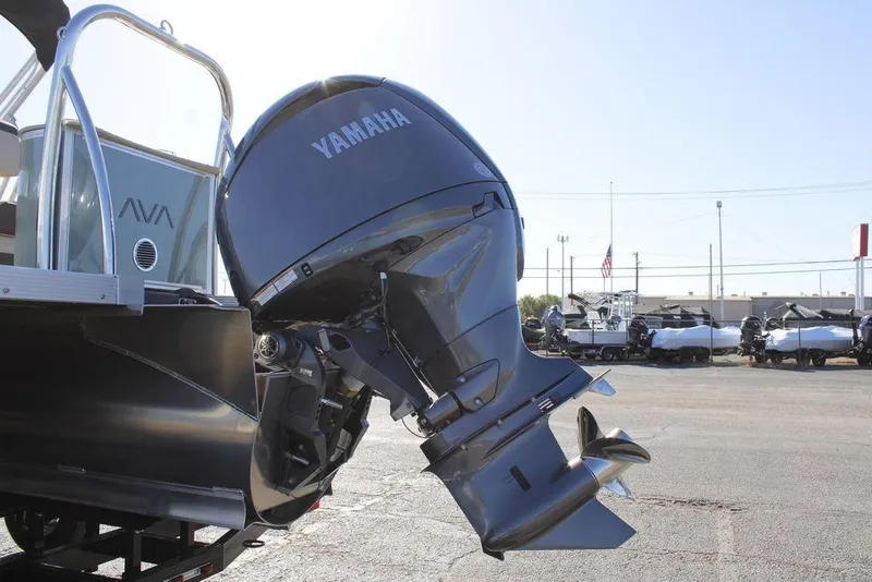 Slide: The Image of 2026 Avalon LSZ Cruise Rear Bench boat with Yamaha outboard motor in a parking lot. - 9