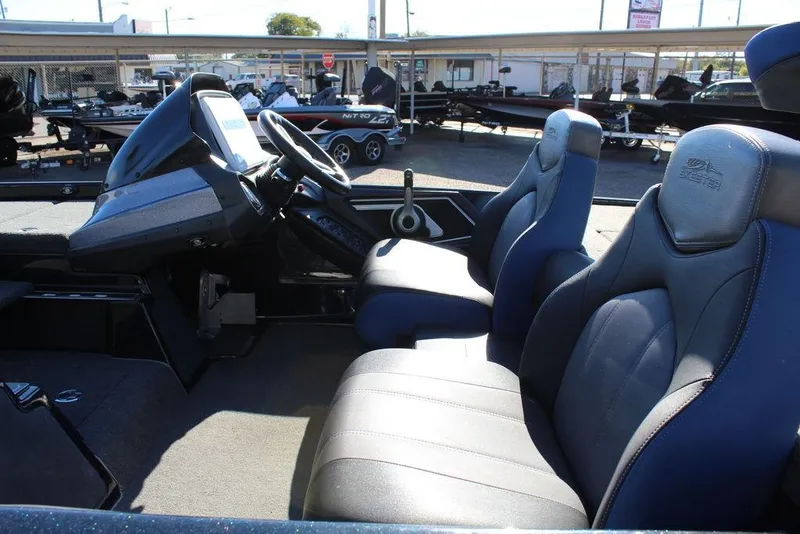 Slide: The Image of 2016 Skeeter FX21 Limited Edition boat interior with dual seats and steering console. - 10