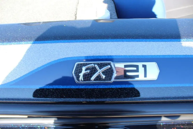 Slide: The Image of 2016 Skeeter FX21 Limited Edition boat emblem on a blue surface. - 12