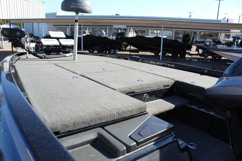 Slide: The Image of 2016 Skeeter FX21 Limited Edition boat deck with storage compartments. - 14