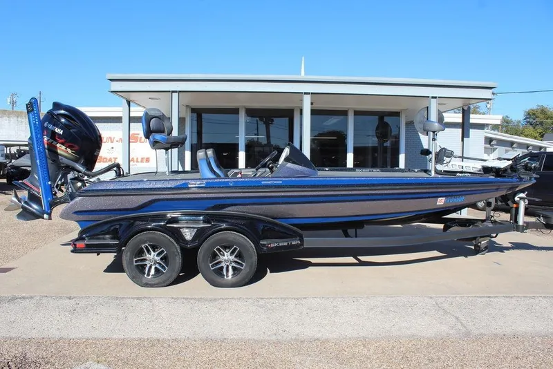 Slide: The Image of 2016 Skeeter FX21 Limited Edition boat with Yamaha engine, parked on a trailer outside a dealership. - 3