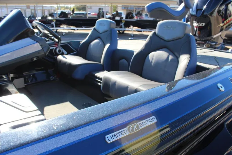Slide: The Image of 2016 Skeeter FX21 Limited Edition boat interior with dual seats and steering console. - 6