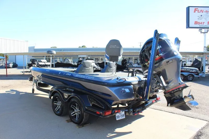 Slide: The Image of 2016 Skeeter FX21 Limited Edition boat with Yamaha outboard motor, parked on a trailer. - 8