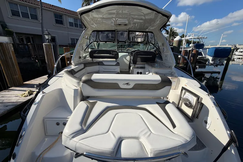 Slide: The Image of 2012 Monterey 400 Sport Yacht with spacious seating at a marina dock. - 10