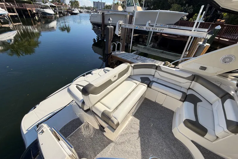 Slide: The Image of 2012 Monterey 400 Sport Yacht with spacious seating at a marina dock. - 12