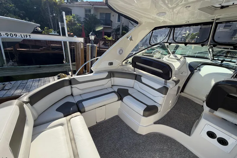 Slide: The Image of Interior of a 2012 Monterey 400 Sport Yacht with plush seating and modern design. - 13
