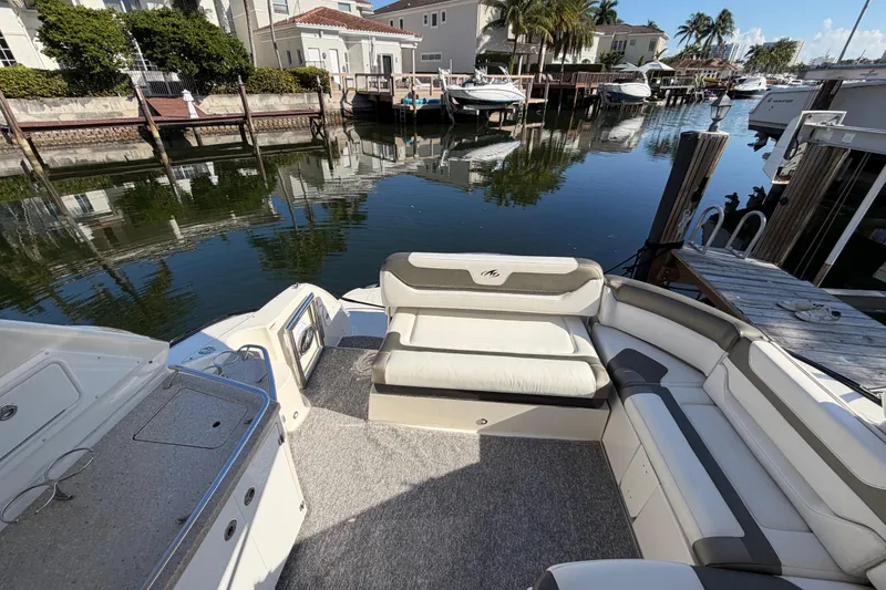Slide: The Image of 2012 Monterey 400 Sport Yacht interior with waterfront view and luxurious seating. - 15