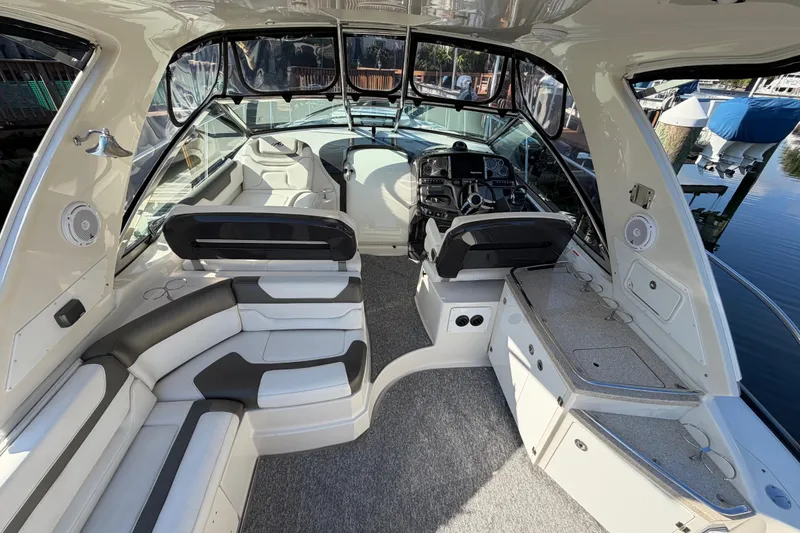 Slide: The Image of Interior of a 2012 Monterey 400 Sport Yacht with luxurious seating and helm. - 16