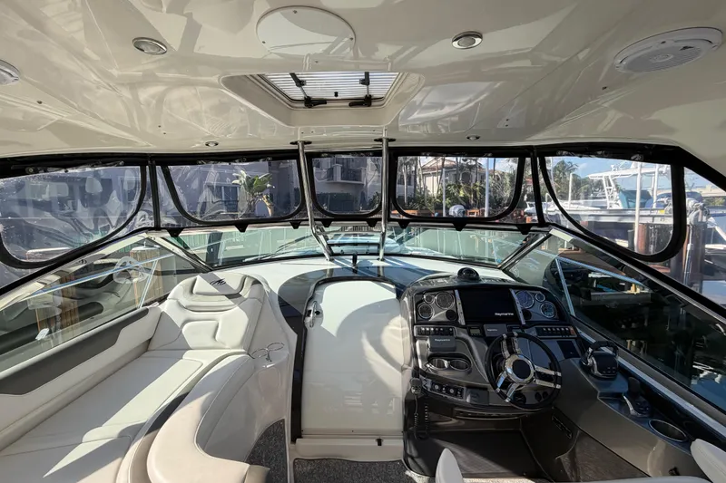 Slide: The Image of Interior view of 2012 Monterey 400 Sport Yacht cockpit with modern controls and seating. - 18
