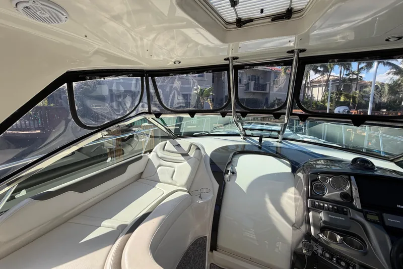 Slide: The Image of Interior view of 2012 Monterey 400 Sport Yacht cockpit with modern controls and seating. - 19