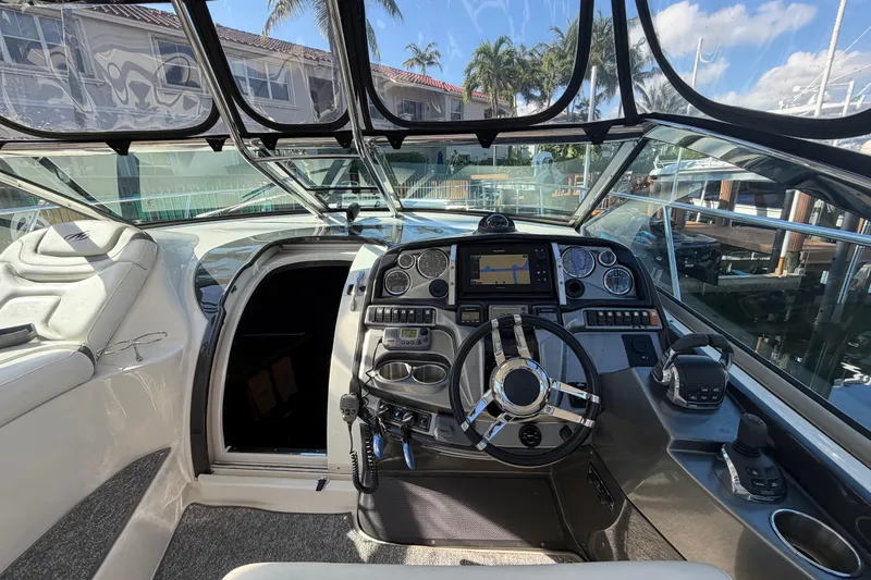 Slide: The Image of Interior view of 2012 Monterey 400 Sport Yacht cockpit with steering wheel and navigation controls. - 20