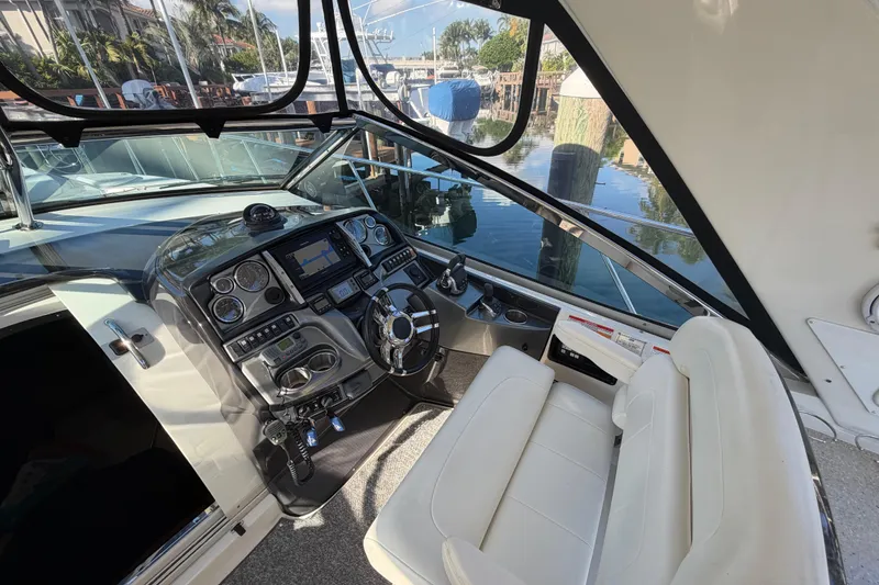 Slide: The Image of Interior cockpit of 2012 Monterey 400 Sport Yacht with modern controls and seating. - 21