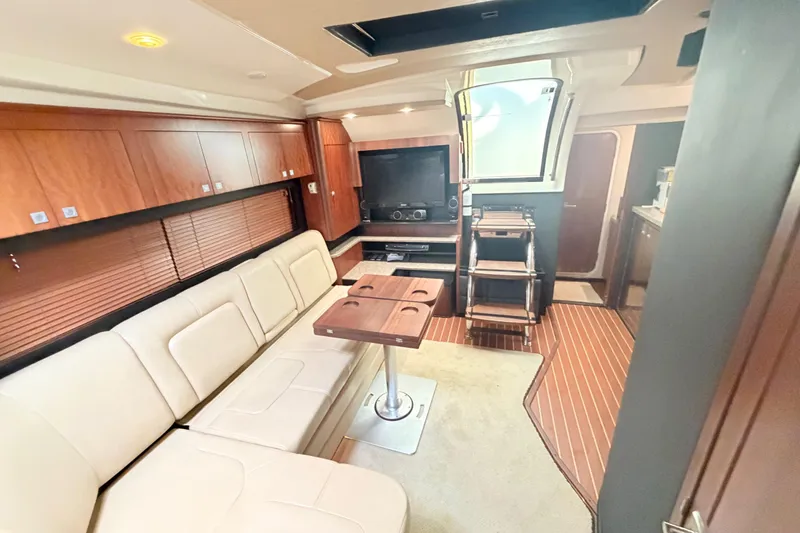 Slide: The Image of Luxurious interior of 2012 Monterey 400 Sport Yacht with plush seating and entertainment area. - 23