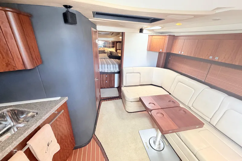 Slide: The Image of Luxurious interior of 2012 Monterey 400 Sport Yacht with elegant seating and wooden cabinetry. - 24