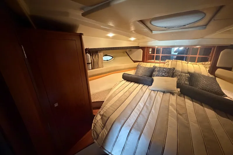 Slide: The Image of Luxurious cabin interior of 2012 Monterey 400 Sport Yacht with cozy bedding and elegant decor. - 32